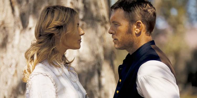 Sienna Miller as Frances looking at Sam Worthington as Gephart outside in Horizon: An American Saga