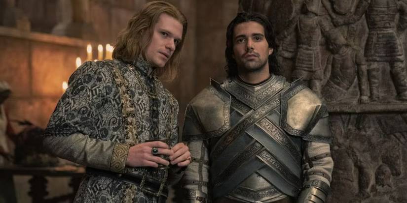 Criston Cole and Joffery Lonmouth stand talking in a castle in House of the Dragon