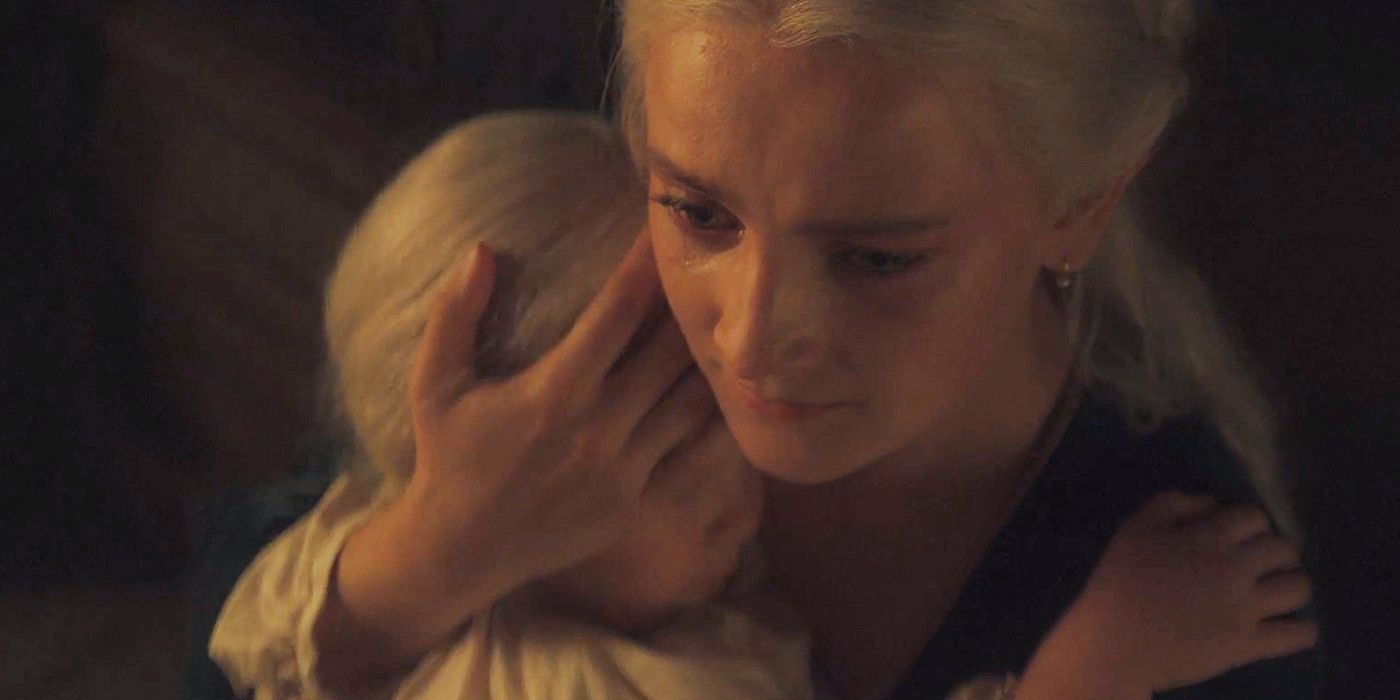 Phia Saban as Helaena cradling her daughter Jaehaera in her arms in House of the Dragon Season 2 Episode 1