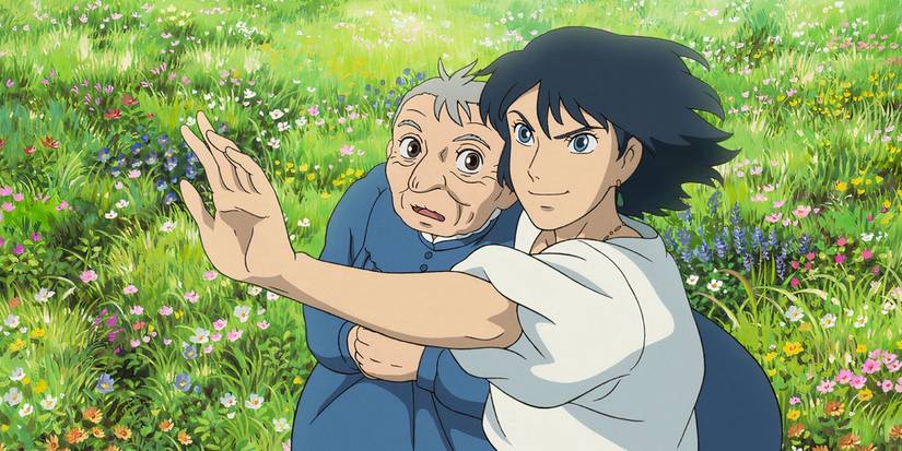 A young man pointing ahead while an old woman stands beside him in Howls Moving Castle.