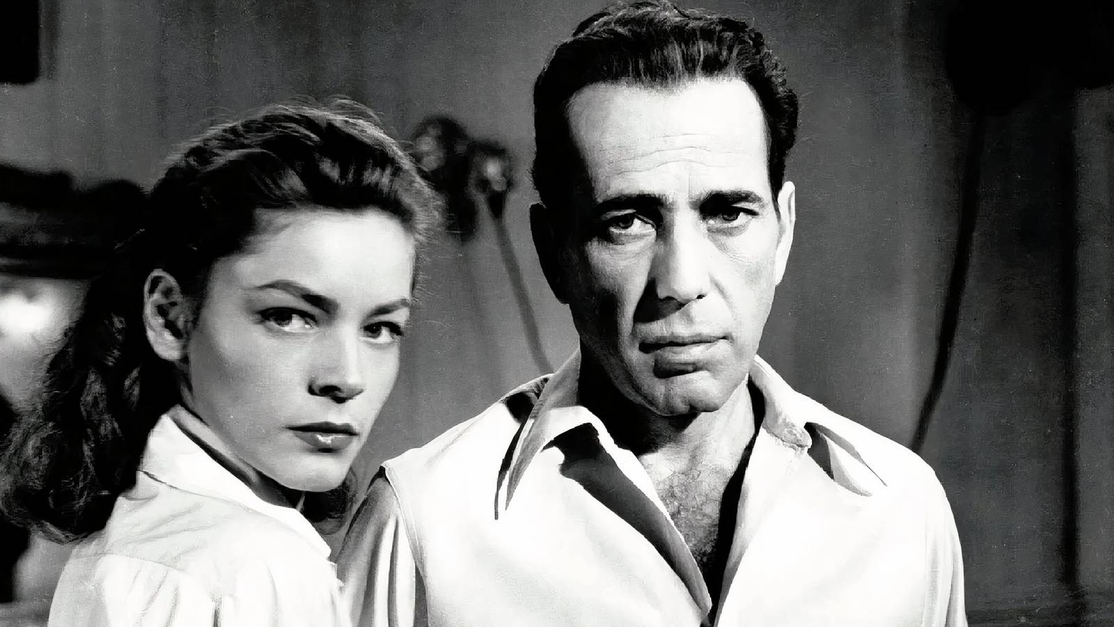 Humphrey Bogart and Lauren Bacall in Key Largo looking at the camera.
