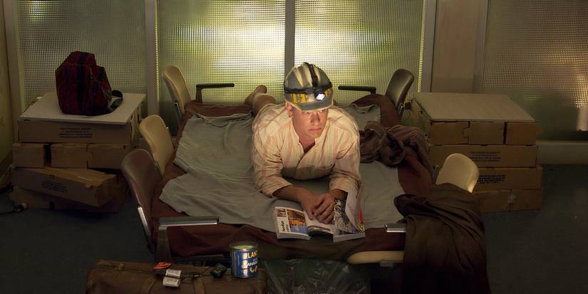 Tom Hanks' Viktor sleeping in his makeshift airport home in The Terminal