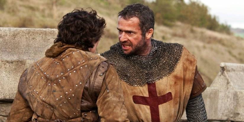A Knight Templar angrily confronts a young squire in 'Ironclad' (2011).