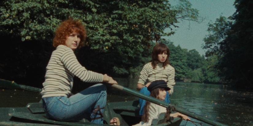 Juliet Berto and Dominique Labourier on a boat with a child in 'Céline and Julie Go Boating' (1)