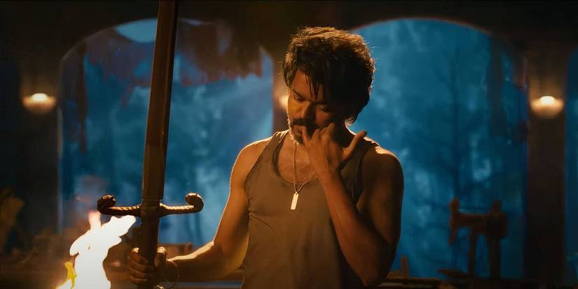 Vijay as Parthiban holding up a sword and putting his pinky finger in his mouth in 'Leo' (2023)