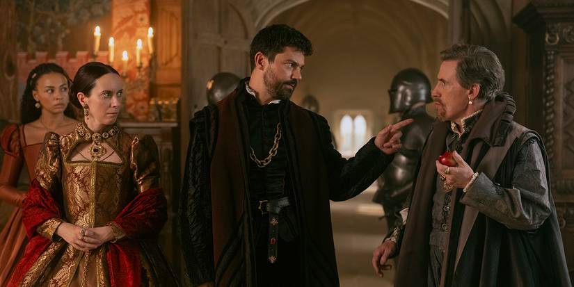 Kate O'Flynn as Mary stands by Dominic Cooper as Seymour pointing at Rob Brydon as Dudley in My Lady Jane