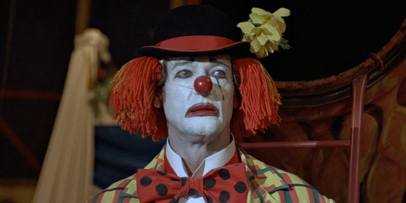 James Bond wears clown make-up and a bright clown costume as he infiltrates the circus in 'Octopussy' (1983).
