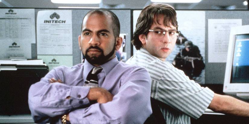 Ajay Naidu as Samir Nagheenanajar and David Herman as Michael Bolton sitting together in Office Space