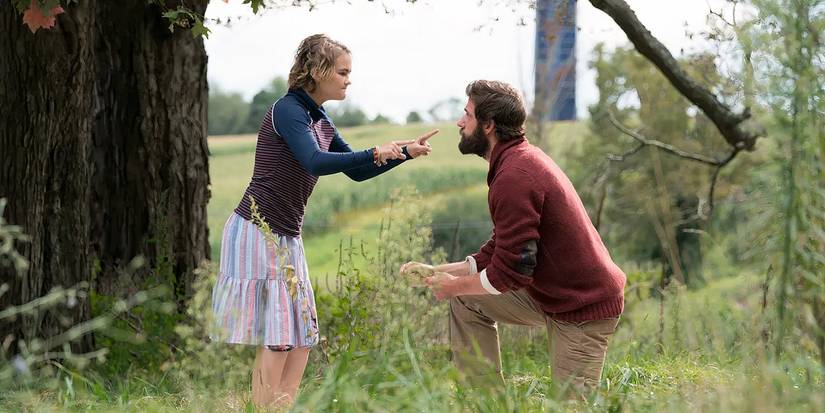An angry Regan (Millicent Simmonds) confronts Lee (John Krasinski) using sign language in A Quiet Place