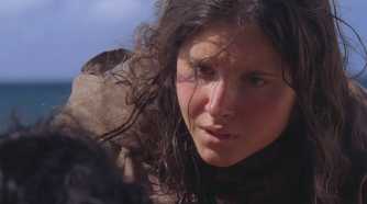 Young Danielle Rousseau (played by Melissa Farman), kneels to speak with Jin (Daniel Dae Kim), on the Island in Lost’s Season 5 Episode ‘The Little Prince.’