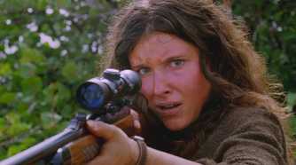 A young Danielle Rousseau (played by Melissa Farman), lifts a hunting rifle, protecting herself from her infected crew in Lost’s Season 5 Episode This Place is Death.
