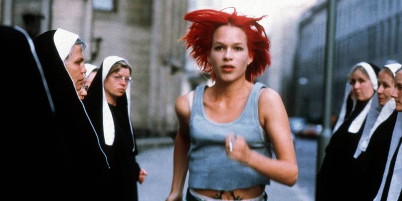 Franka Potente as Lola running through a group of nuns in Run Lola Run. 
