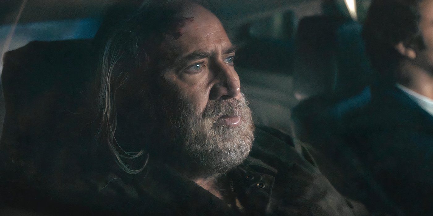 Nicolas Cage in a car looking ahead in Pig