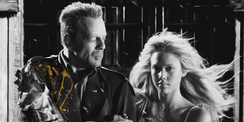Bruce Willis' John standing with Jessica Alba's Nancy in Sin City