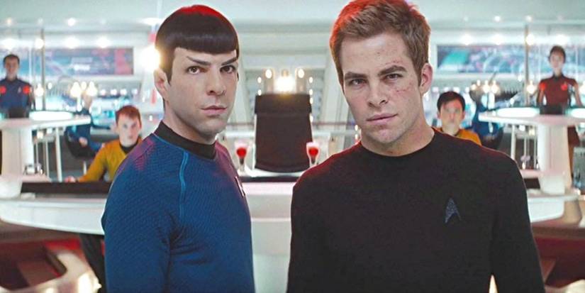 Zachary Quinto and Chris Pine looking at the camera in the Enterprise control room in Star Trek.