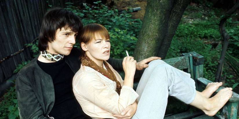 Glenda Jackson rests against Murray Head on a park bench in Sunday Bloody Sunday