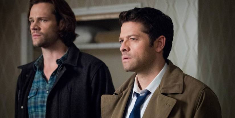 Sam Winchester (Jared Padalecki) stands by Castiel (Misha Collins), both confused, in 'Supernatural'.