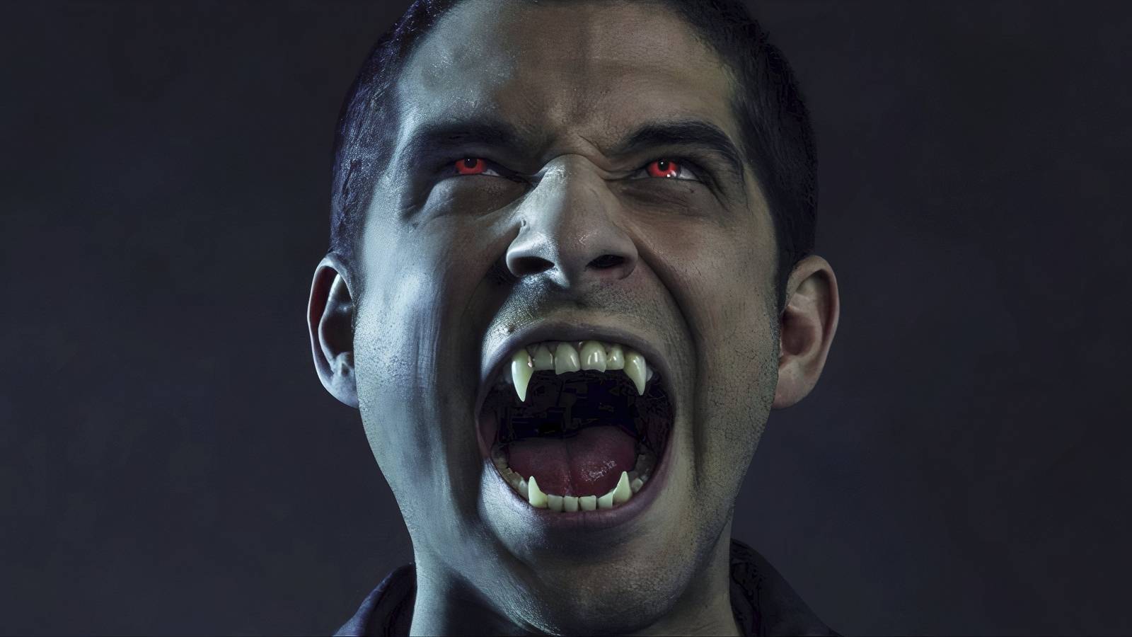 Close-up of Tyler Posey as Scott, about to turn into a wolf in Teen Wolf.