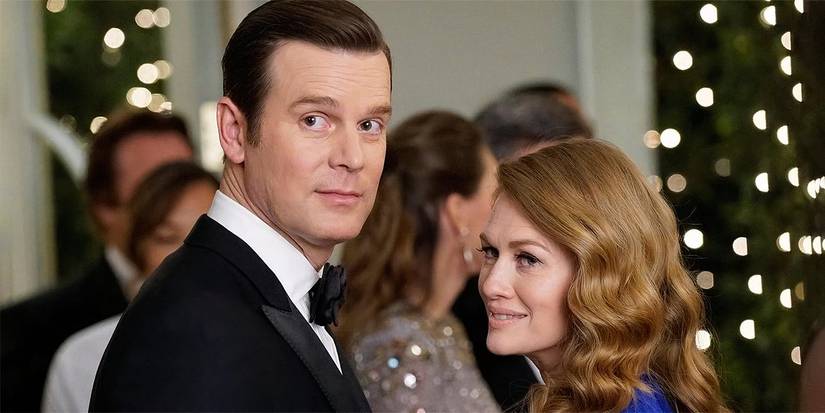 Peter Krause standing next to Mireille Enos in The Catch