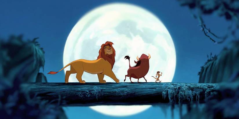 Timon Pumba and Simba walking across a log in the moonlight in The Lion King.