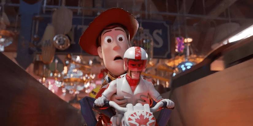 Woody and Duke Caboom riding a bike in 'Toy Story 4'
