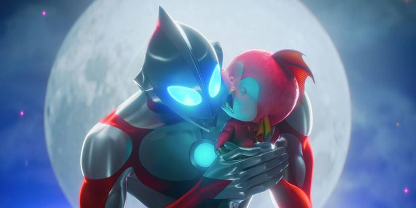 Ultraman holding a sleeping baby Kaiju by the full moon in Ultraman: Rising.