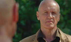 Charles Widmore (played by Alan Dale), looks stoically at the Man in Black (Terry O’Quinn) on the Island in Lost’s Season 6 Episode ‘The Package.’