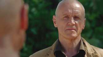 Charles Widmore (played by Alan Dale), looks stoically at the Man in Black (Terry O’Quinn) on the Island in Lost’s Season 6 Episode ‘The Package.’