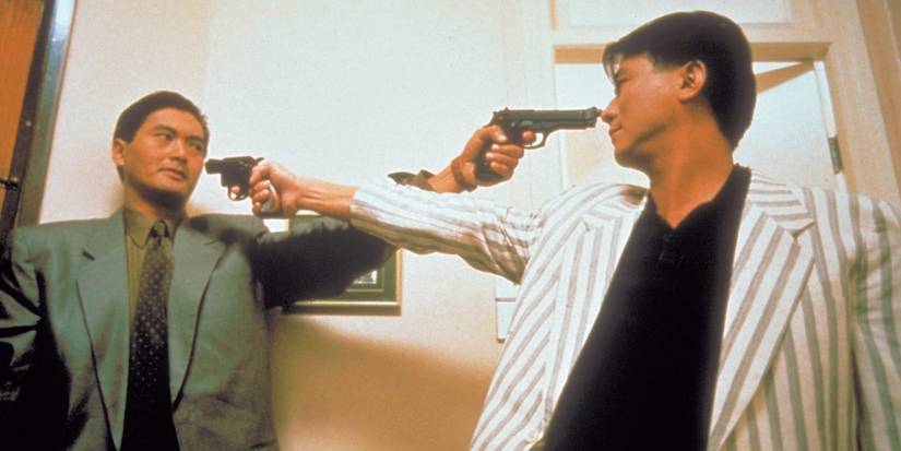 Chow Yun-Fat and Danny Lee holding each other at gun point in The Killer.