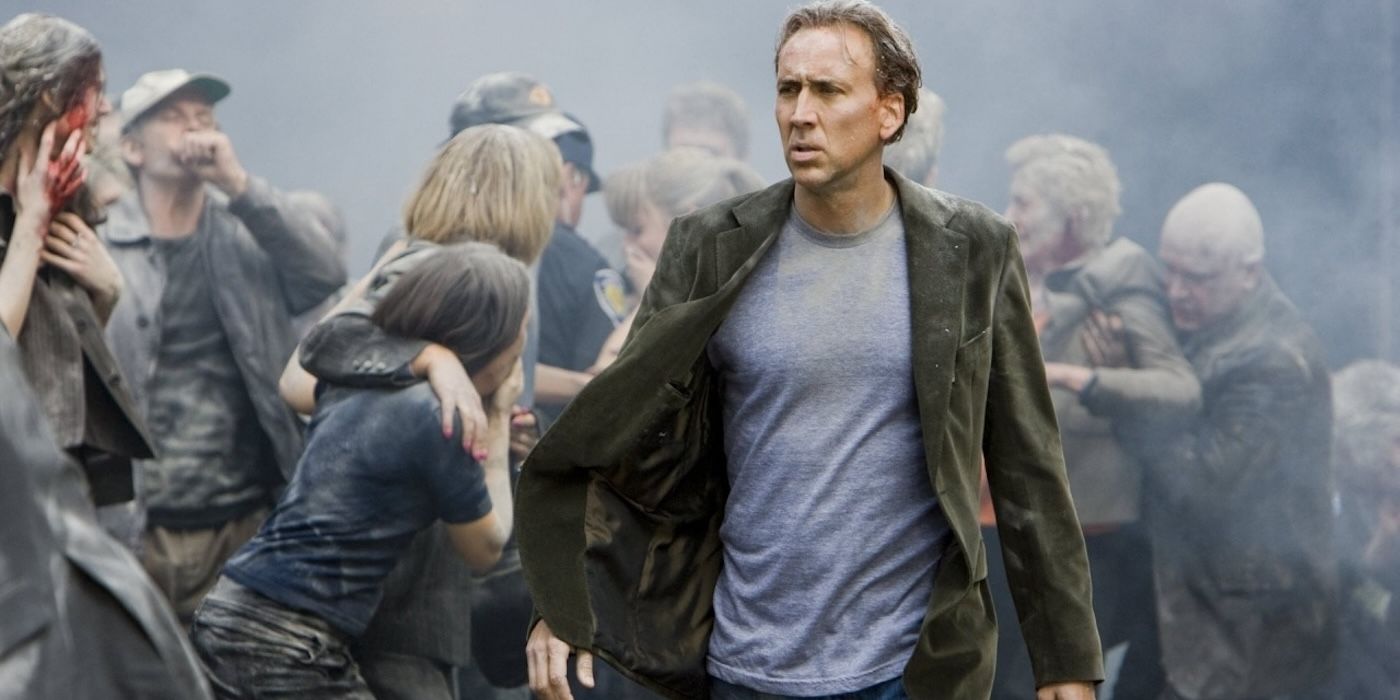 John walking through a crowd after a disaster in Knowing