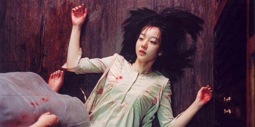 Im Soo-jung laying on the ground in A Tale of Two Sisters