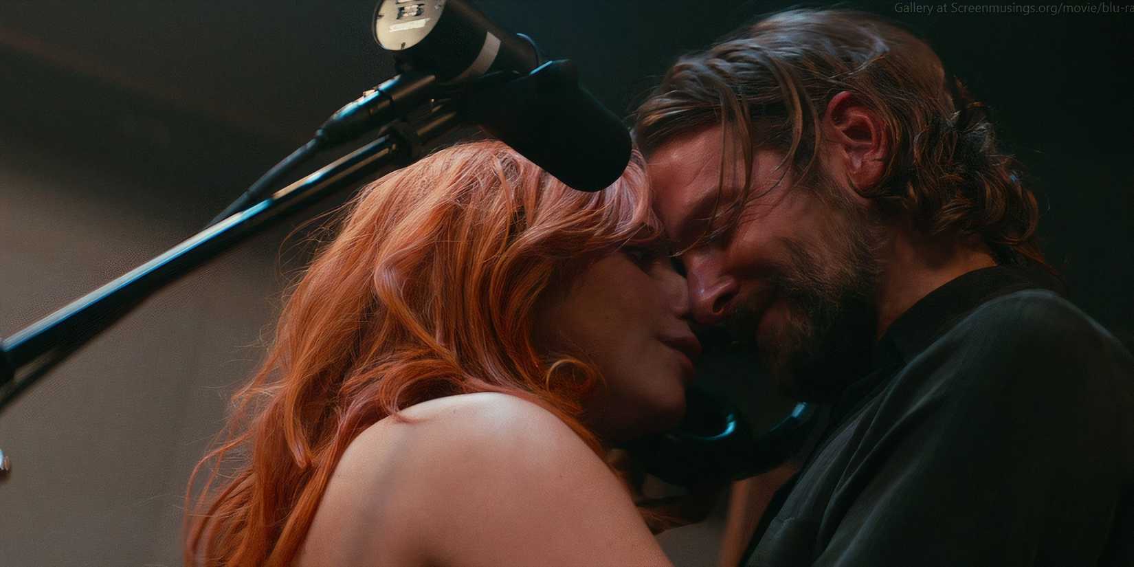 Ally (Lady Gaga) and Jackson (Bradley Cooper) embrace in 'A Star Is Born' (2018)
