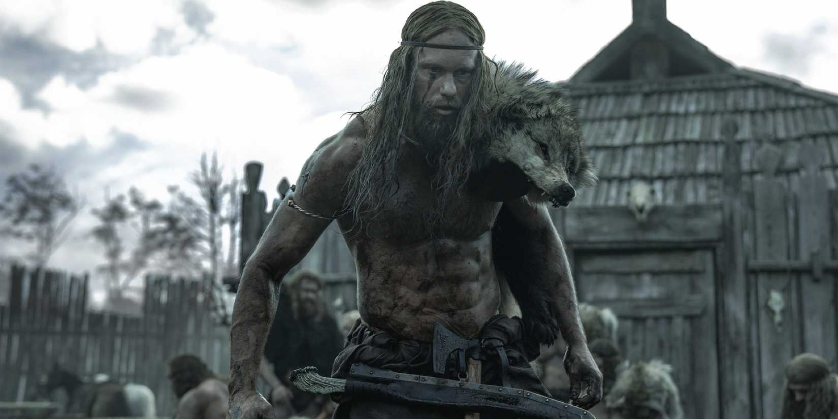 The Viking Amleth, played by Alexander Skarsgård, lumbers through a village, covered in blood 
