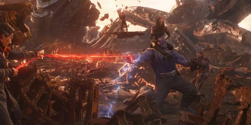 The Avengers and Guardians holding down Thanos in Avengers: Infinity War.