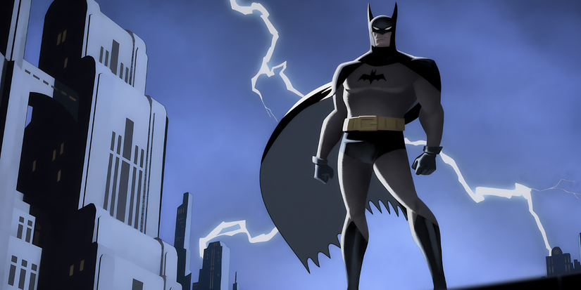Batman standing on a rooftop as lightning strikes behind him Batman Caped Crusader.