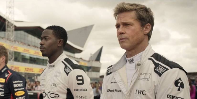 Brad Pitt and Damson Idris as Sonny Hayes and Joshua "Noah" Pearch in their racing uniforms in F1.