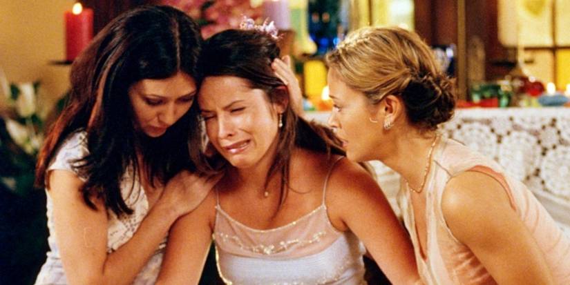 Shannen Doherty and Alyssa Milano comforting Holly Marie Combs who is sobbing in Charmed.