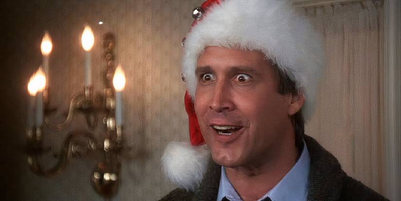 Clark Griswold wearing a Santa hat and looking intently in National Lampoon's Christmas Vacation