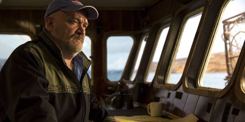 Captain Keith Colburn looking serious, standing at the helm of a ship on Deadliest Catch.