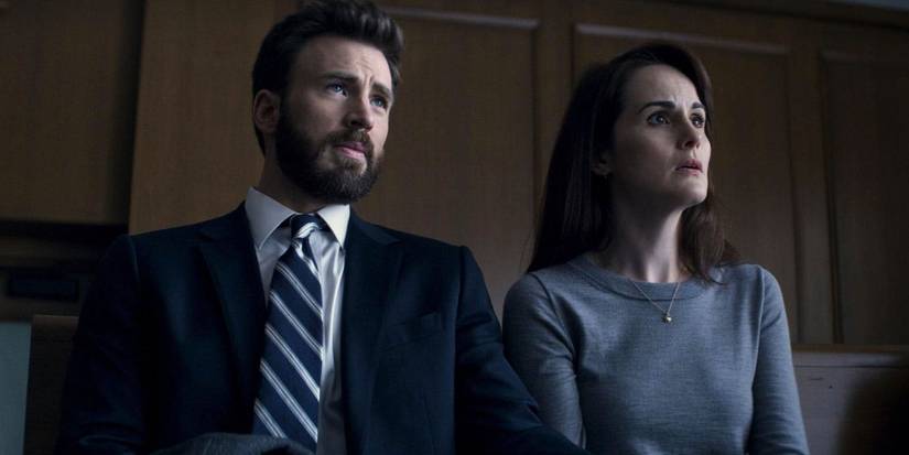 Andy (Chris Evans) and Laurie (Michelle Dockery) sit in a courtroom in a scene from 'Defending Jacob.'