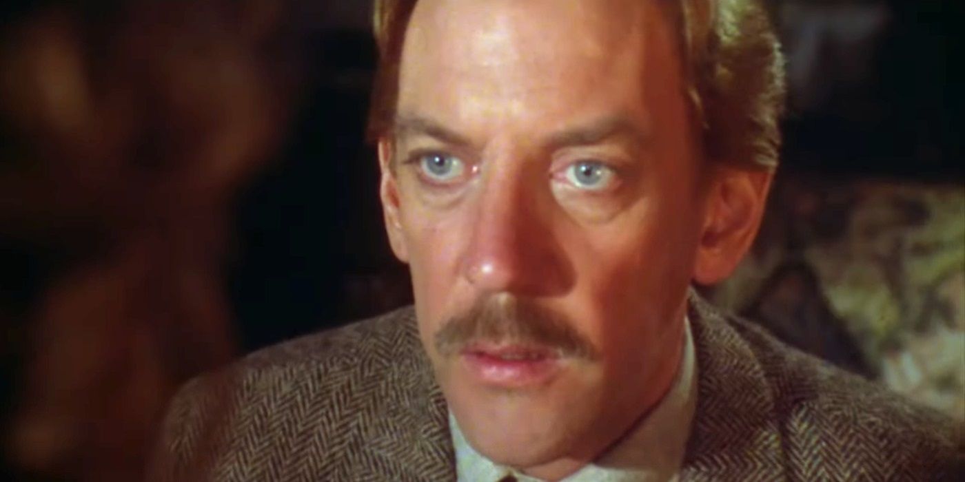 Donald Sutherland como Henry Faber mira al frente en 