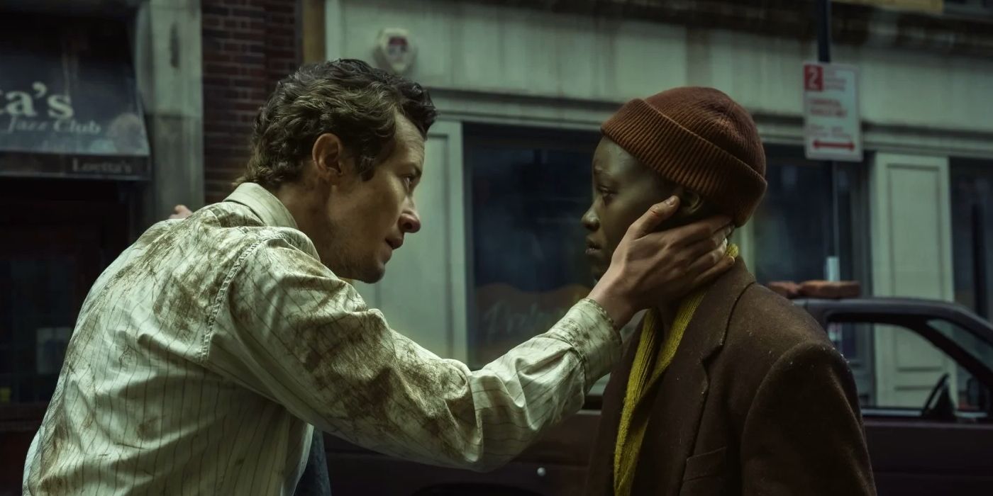 Eric comforting Sam with a hand on her cheek in A Quiet Place: Day One