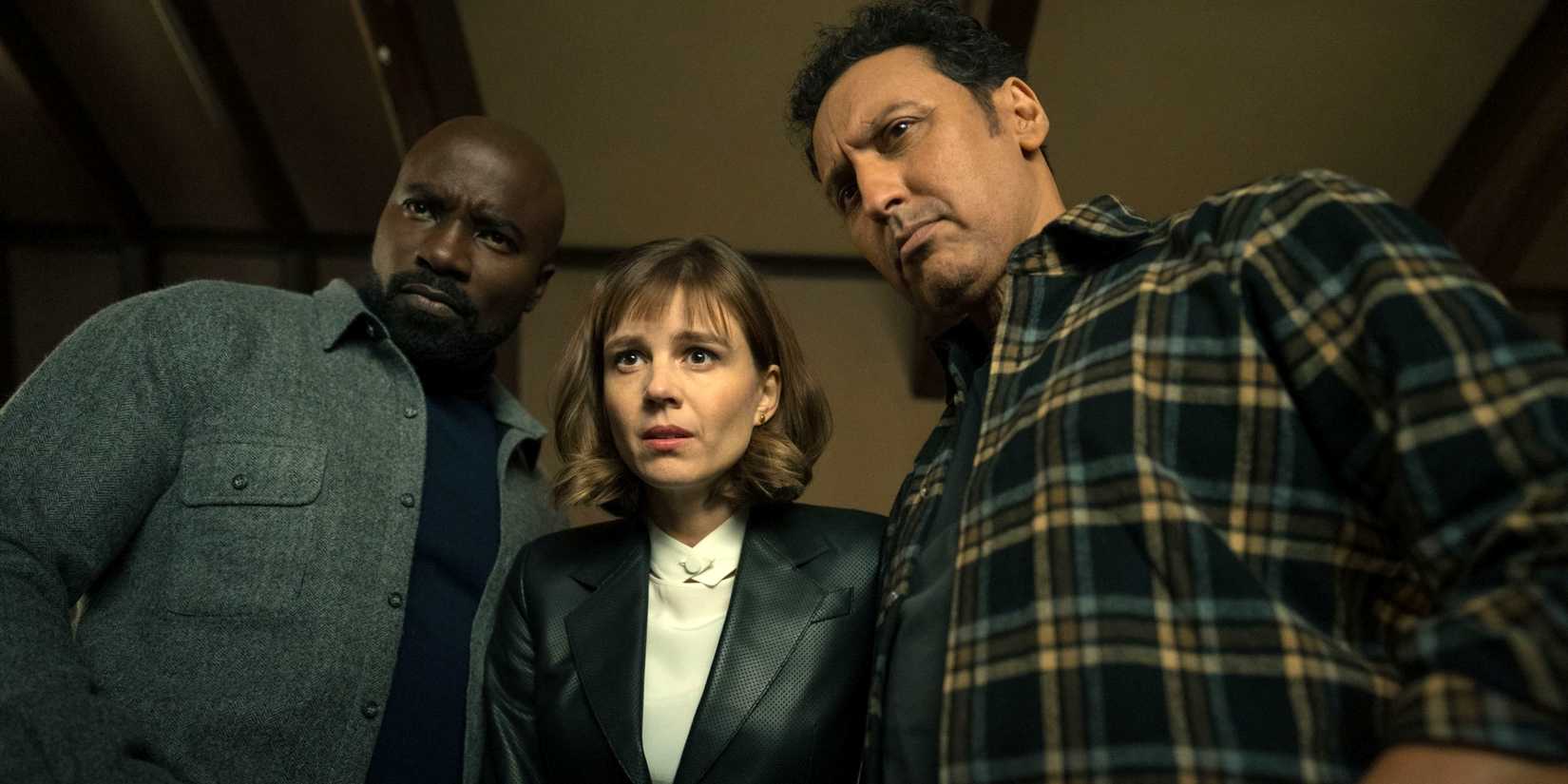 Katja Herbers, Mike Colter & Aasif Mandiv standing over and looking down at something in Season 4 of Evil
