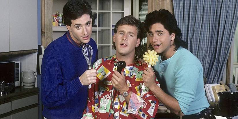 Bob Saget, John Stamos, and Dave Coulier in Full House singing into an whisk, sponge, and faucet.