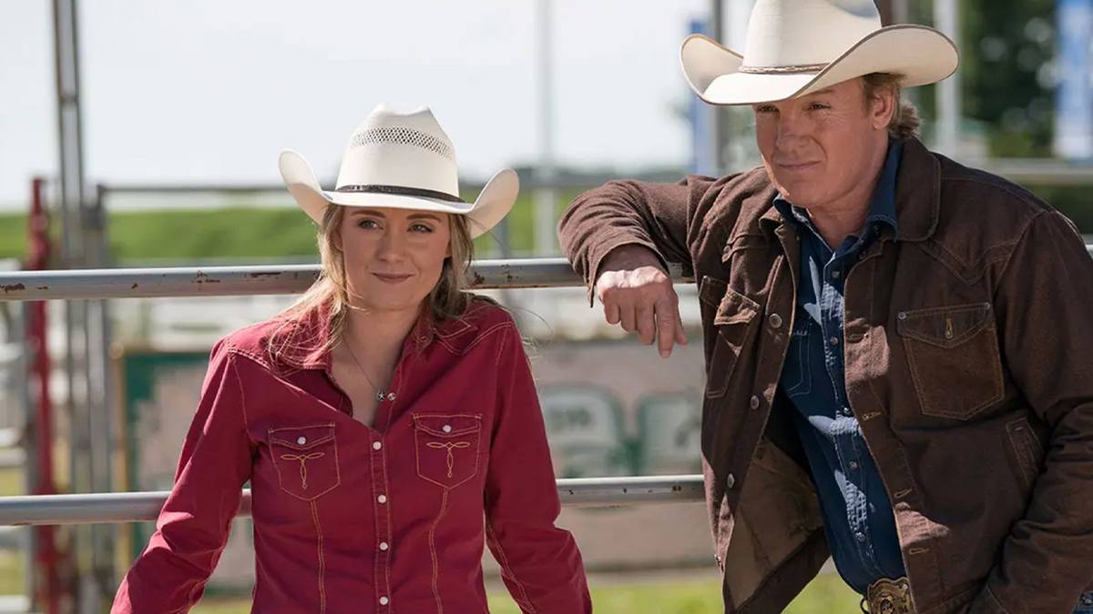 Amy (Amber Marshall) and her dad, Tim Fleming (Chris Potter), near a fence in 'Heartland.'