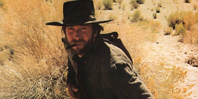 Clint Eastwood as The Stranger looking at a person offscreen in High Plains Drifter