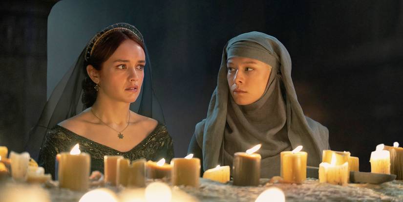 Alicent and Rhaenyra in her septa disguise in the Sept talking in front of candles in House of the Dragon.