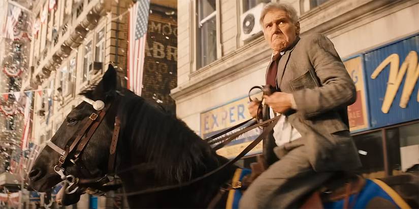 Harrison Ford as Indiana Jones looking peeved on a horse in Indiana Jones and the Dial of Destiny