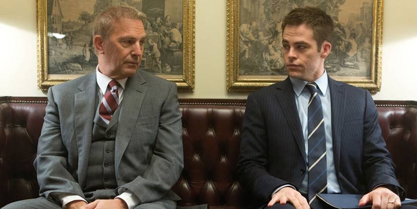 Kevin Costner and Chris Pine on a bench looking at each other in Jack Ryan: Shadow Recruit
