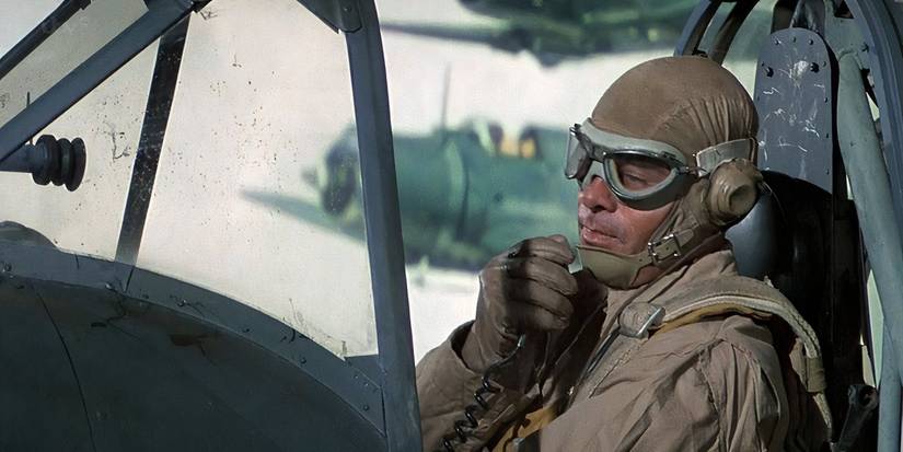 A man talking a walkie flying a plane in Midway